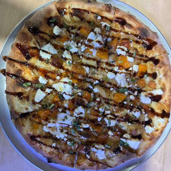 A Tennessee Avenue Beer Hall pizza with butternut squash, goat cheese, and balsamic glaze.