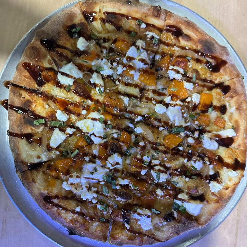 A Tennessee Avenue Beer Hall pizza with butternut squash, goat cheese, and balsamic glaze.